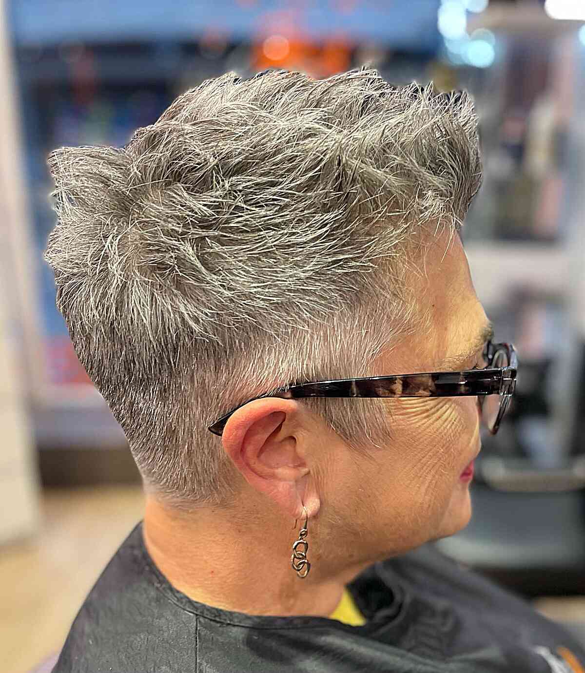 super short brushed up pixie hairstyle with spikes for women aged sixty