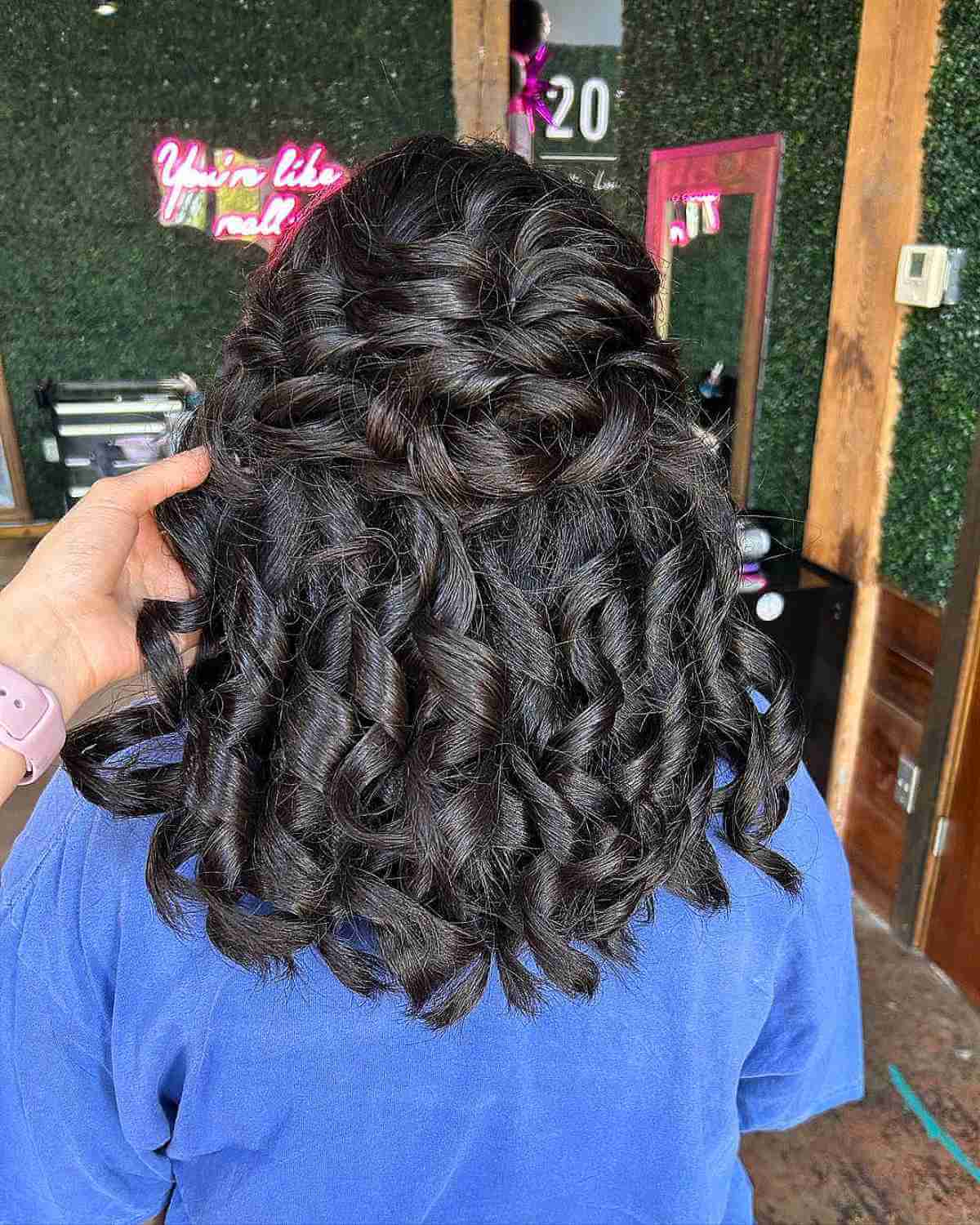 the voluminous curls for medium half upstyle on female graduates