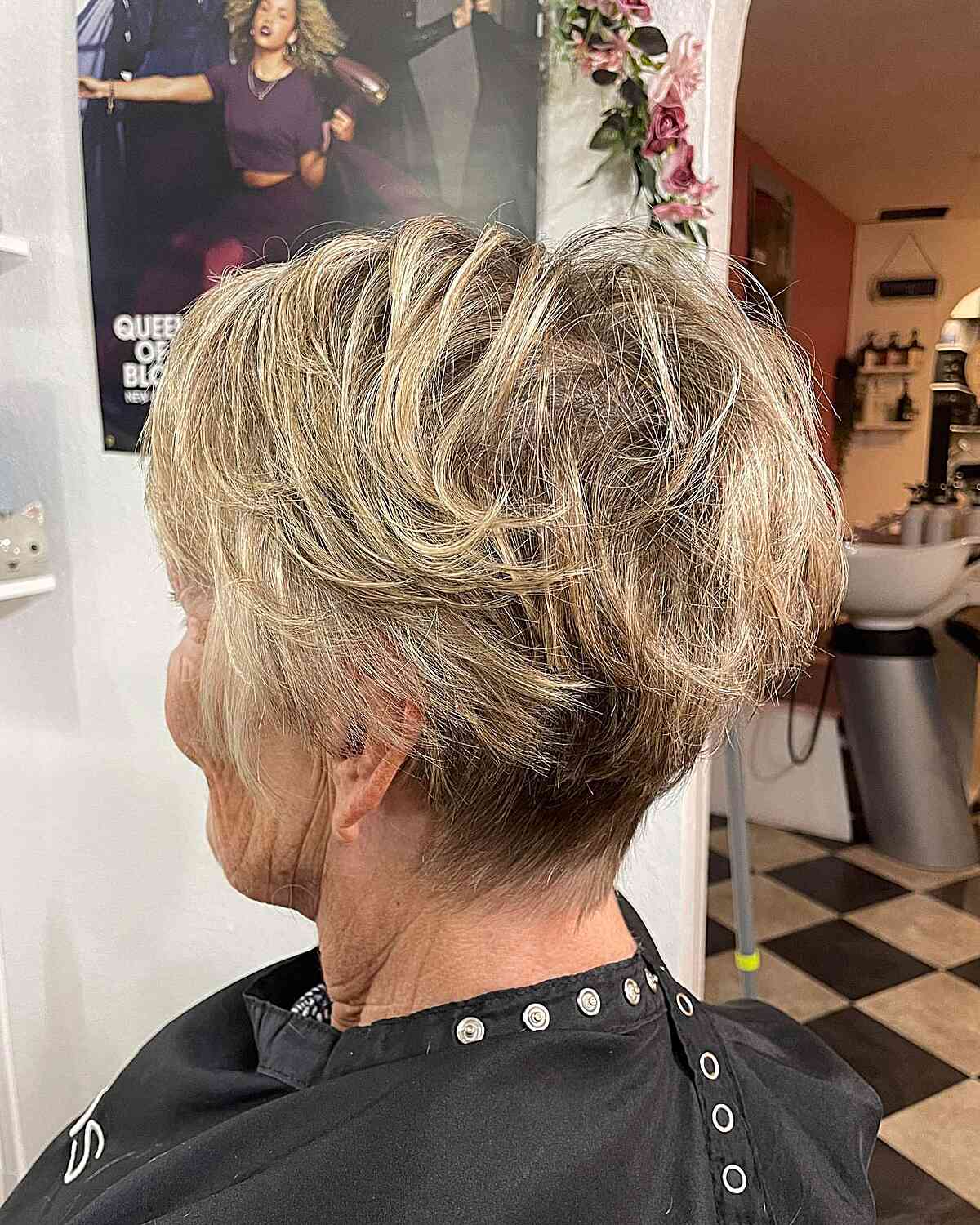 tousled pixie with choppy layers and blonde highlights for seniors over