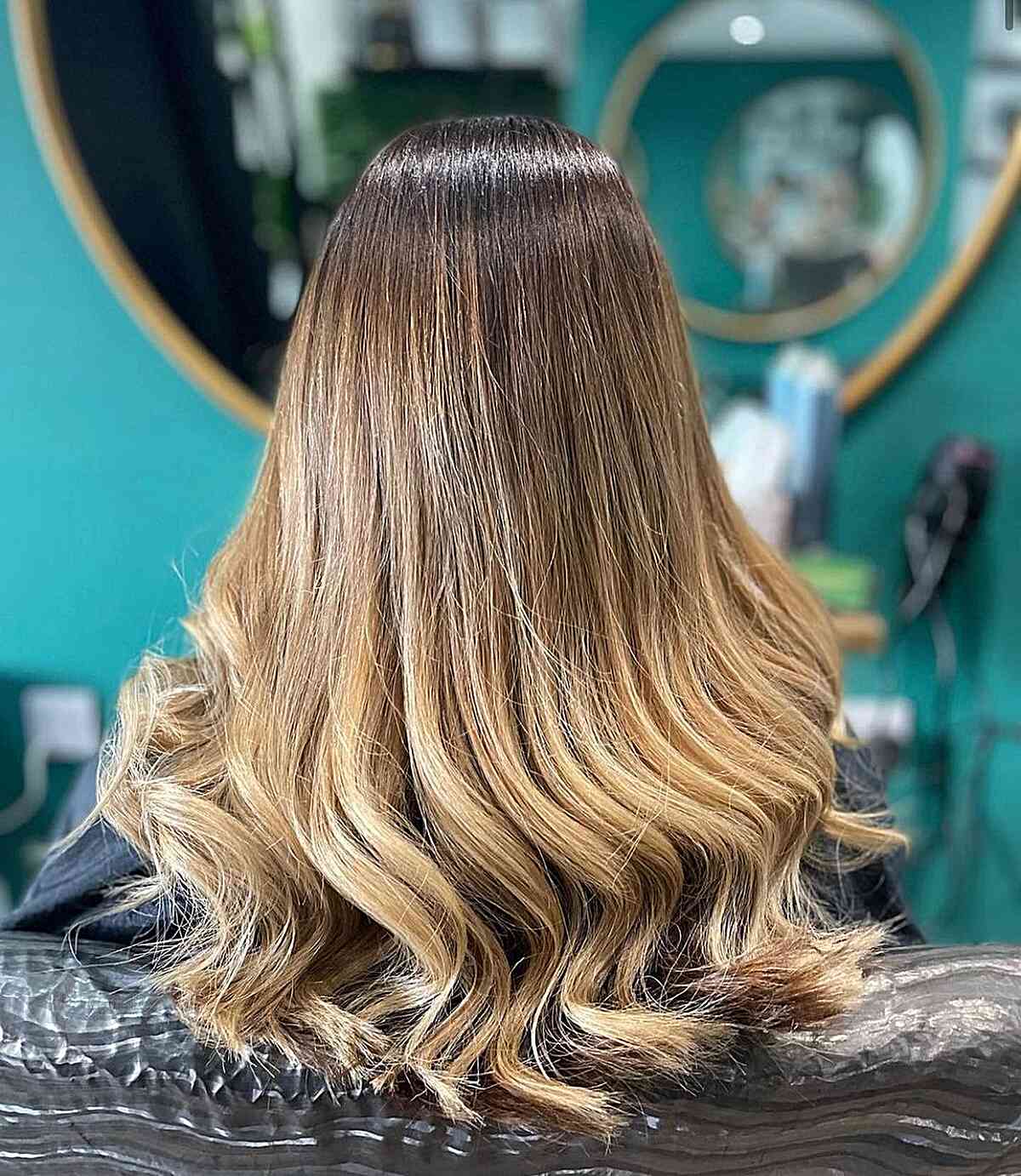 warm blonde ombre balayage with dark roots