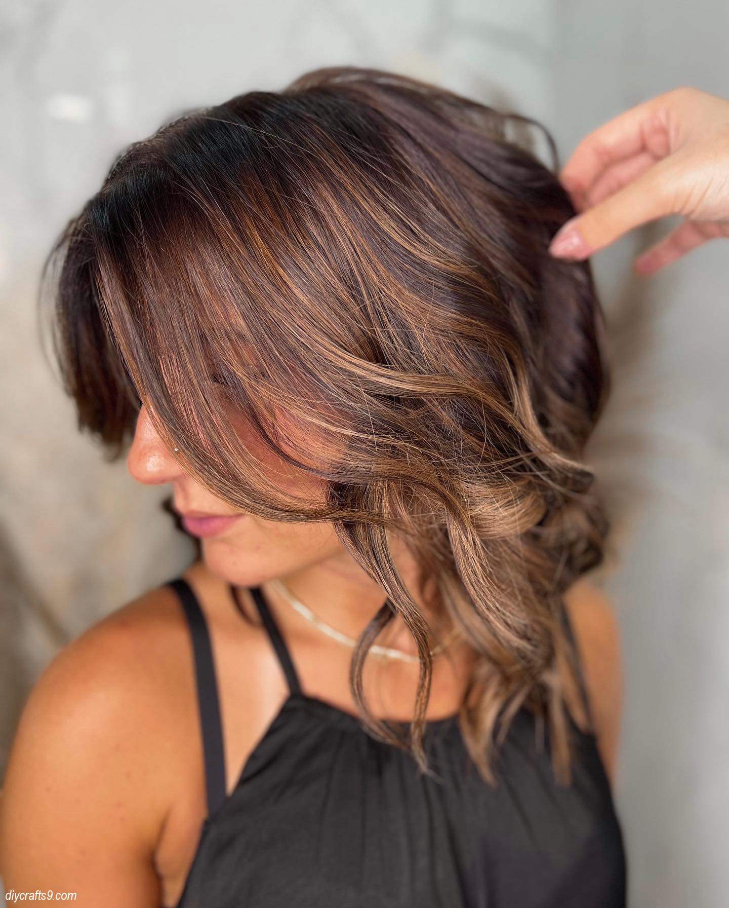 Wispy Brown Hair With Caramel Highlights Short Look