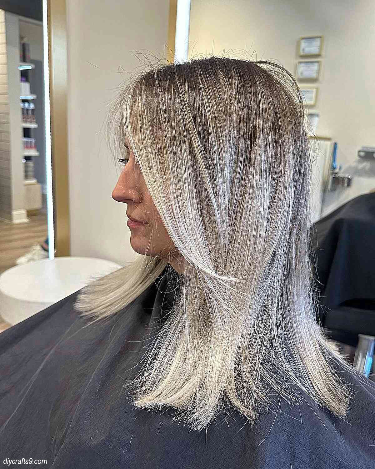 low maintenance icy blonde straight balayage hair with face frame
