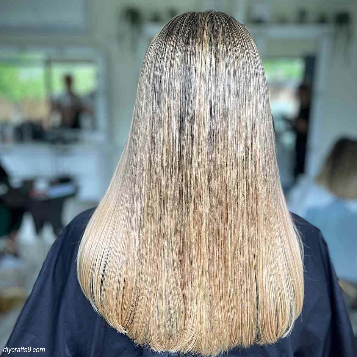 straight haircut with light golden blonde balayage and root melt