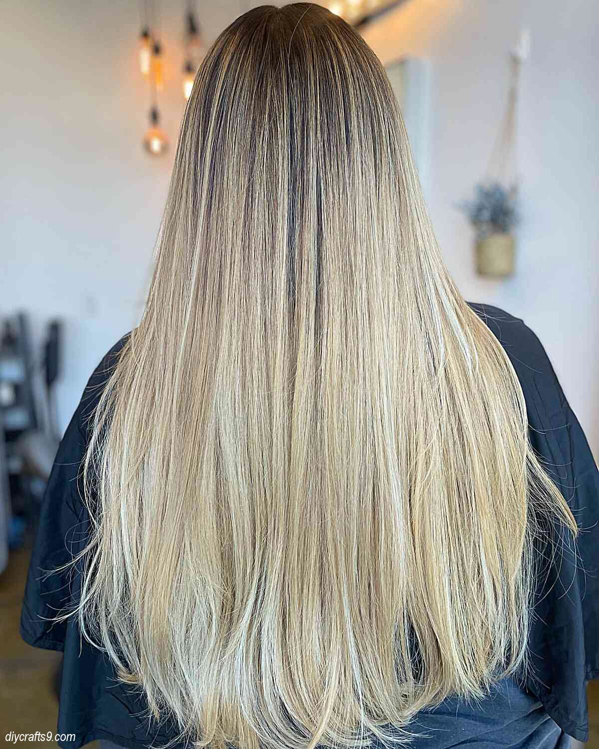 straight summer blonde balayage hair with dark roots
