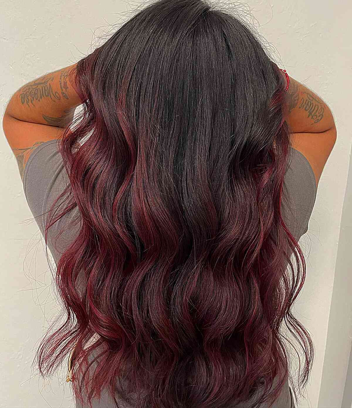 dark red burgundy balayage highgliths with black roots