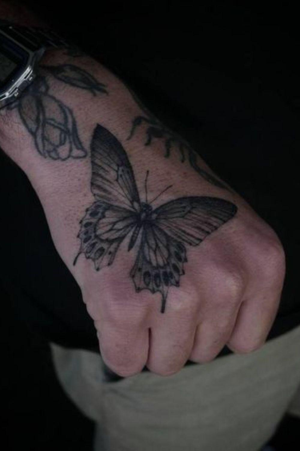 Black and Grey Butterfly Hand Tattoo