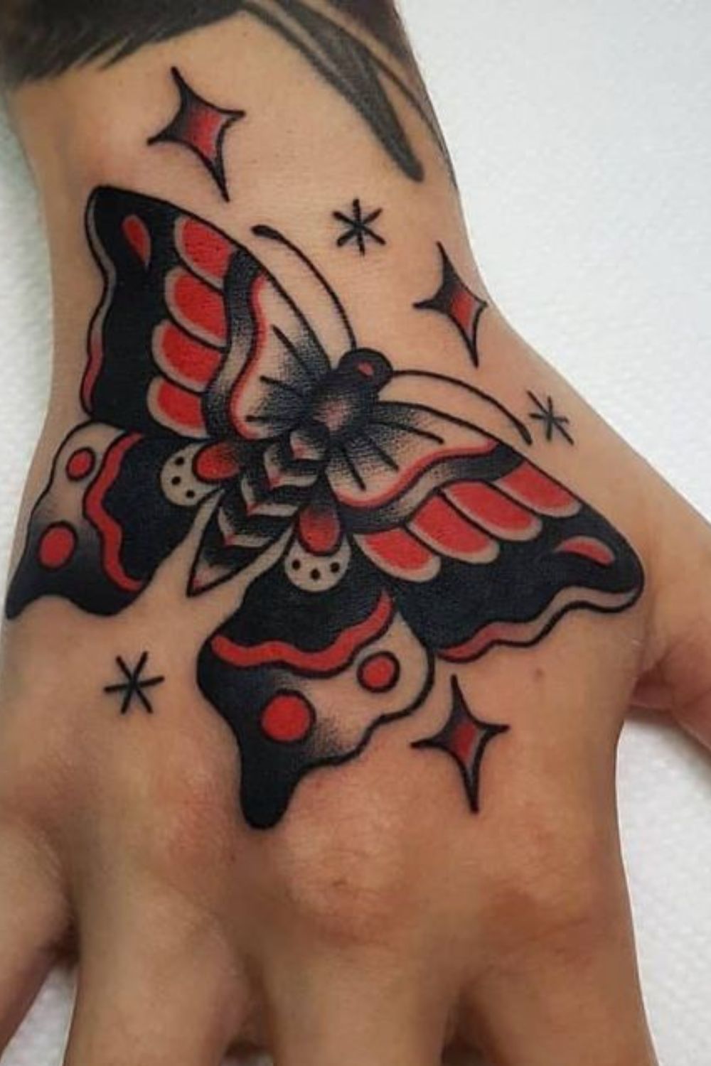 Colorful Tribal Butterfly Hand Tattoo