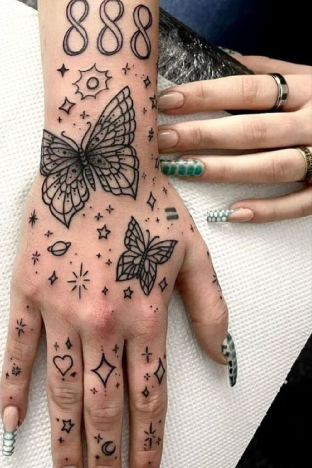 Cosmic Butterfly Hand Tattoo