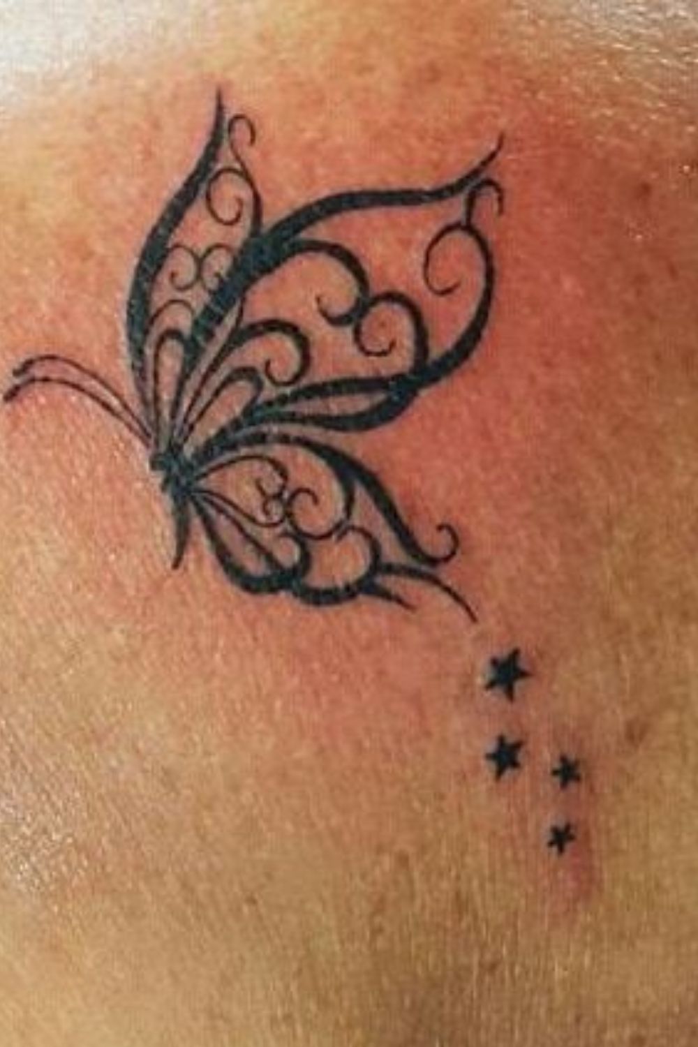 Dainty Butterfly Hand Tattoo