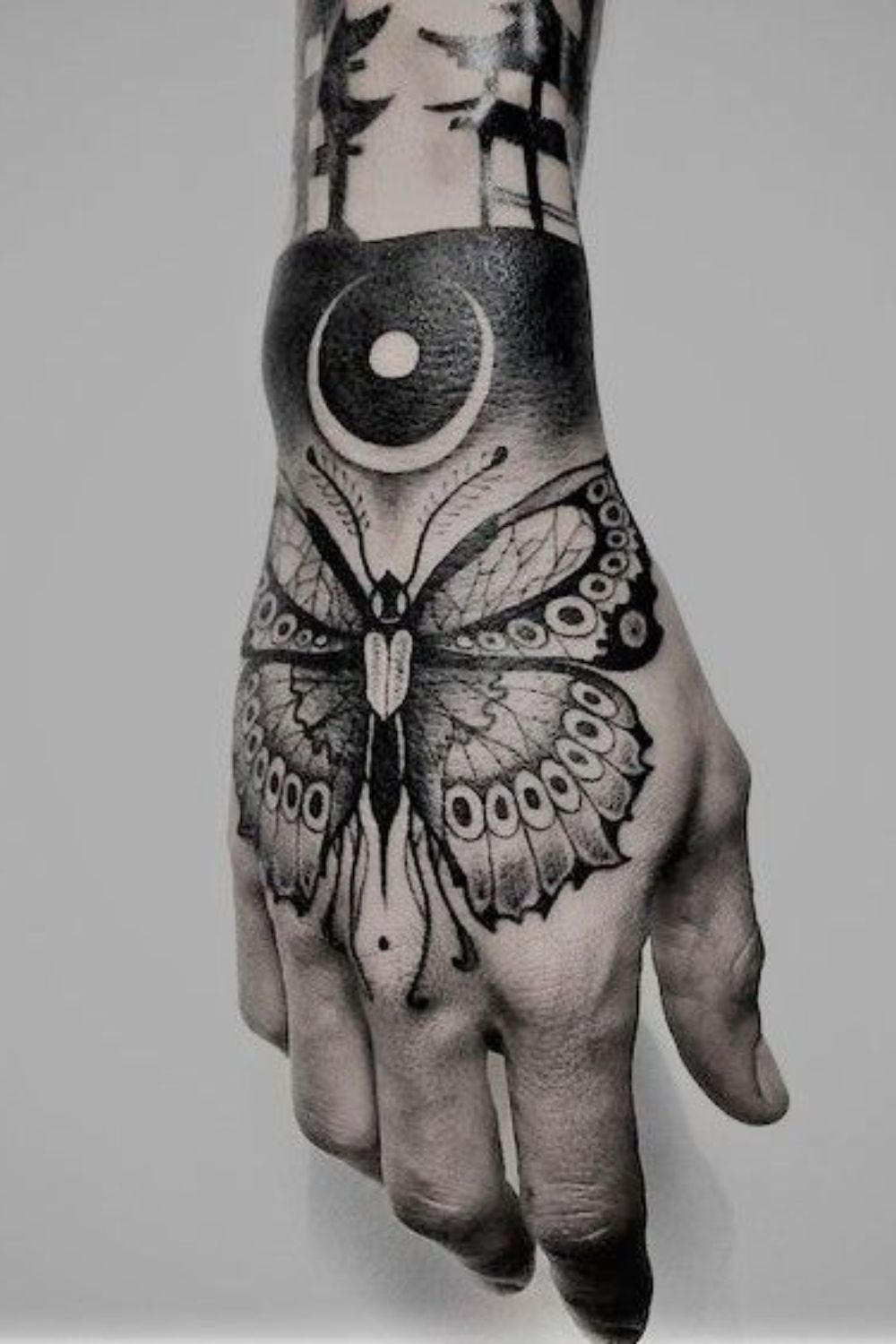 Enchanted Forest Butterfly Hand Tattoo