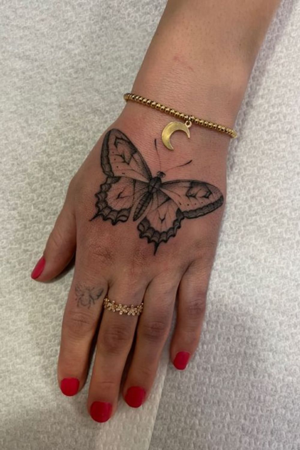 Geometric Butterfly Hand Tattoo