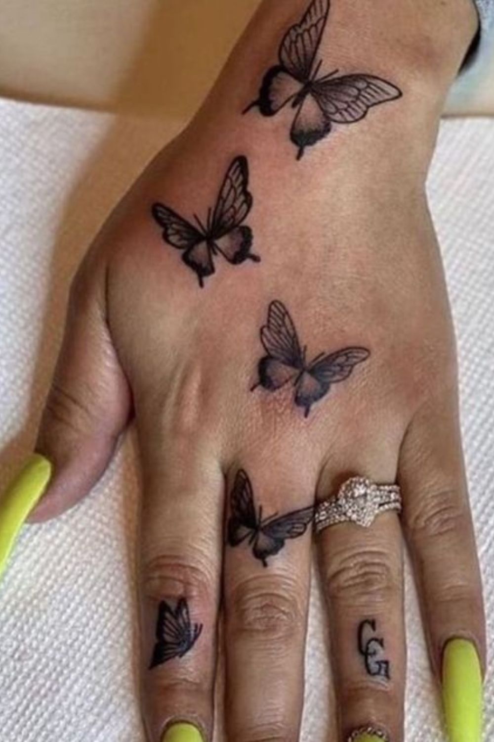 Minimalist Butterfly Hand Tattoo
