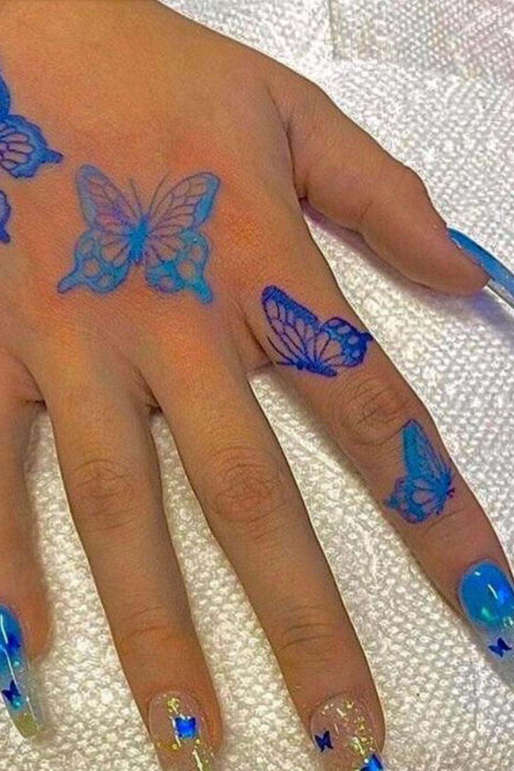 Neon Butterfly Hand Tattoo
