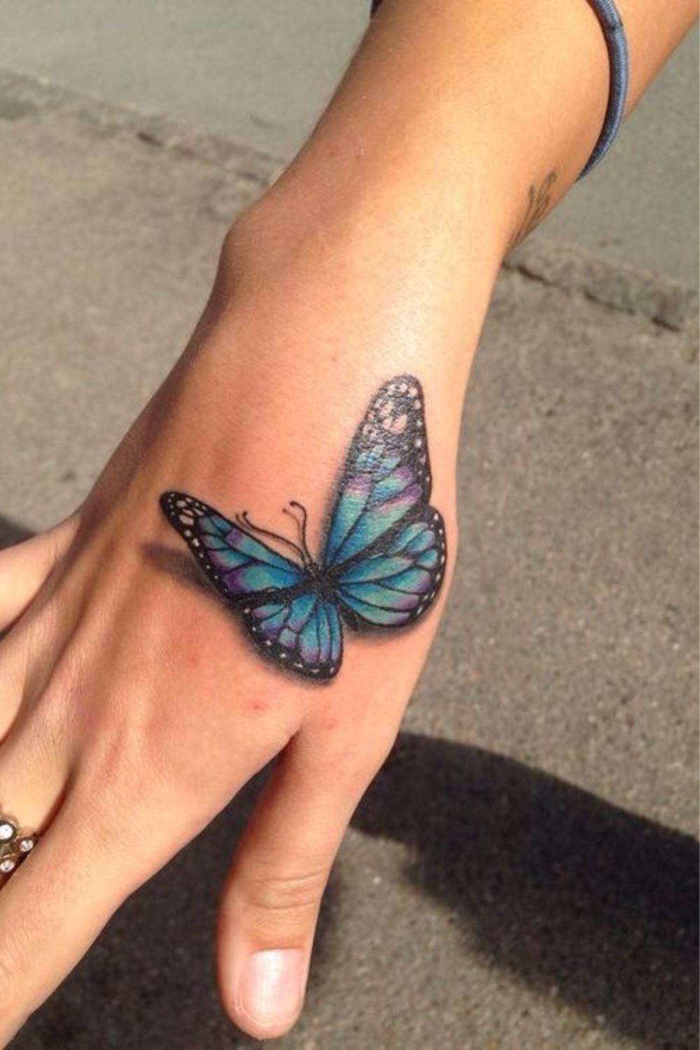 Watercolor Butterfly Hand Tattoo